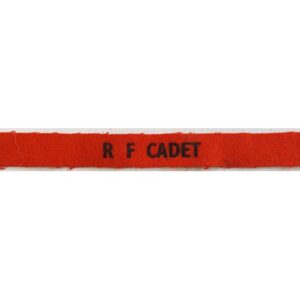 CST028. R F CADET, black printed on red wool, small size, unused