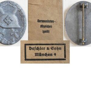FM0573. WOUND BADGE 1939 in gold, grey zinc, with packet